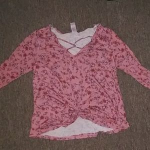 A small, long sleeved crop top... Flower designed